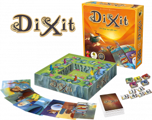 A photo of the contents of the board game Dixit. Large cards showing fanciful illustrations surround  a scoring track designed to look like rabbits hopping along a path.