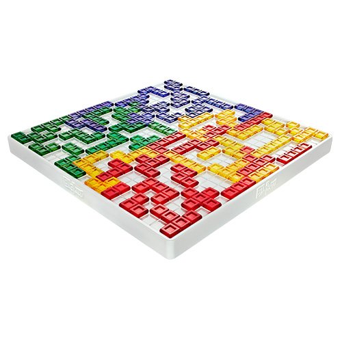 Photo of a game of Blockus in progress. A grooved central board is covered in tetris-like shapes in colours representing four players.